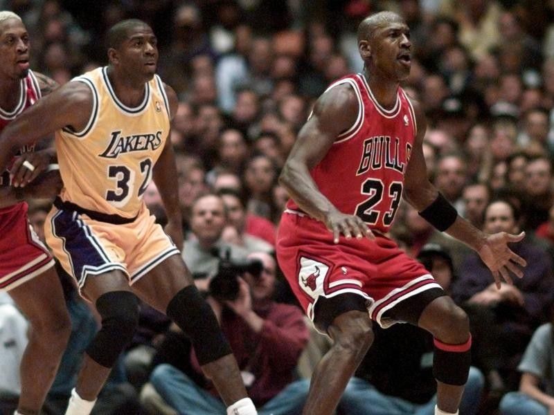 Michael Jordan and Dennis Rodman defend Magic Johnson