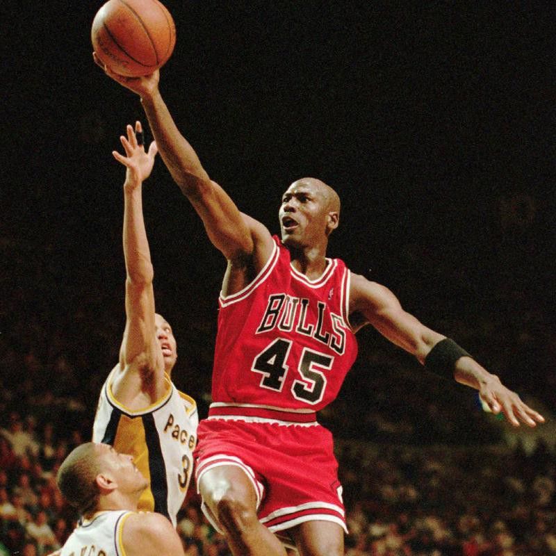 Michael Jordan drives to basket