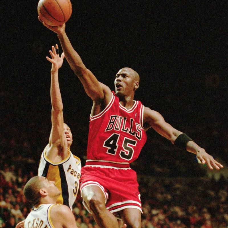 Michael Jordan drives to hoop