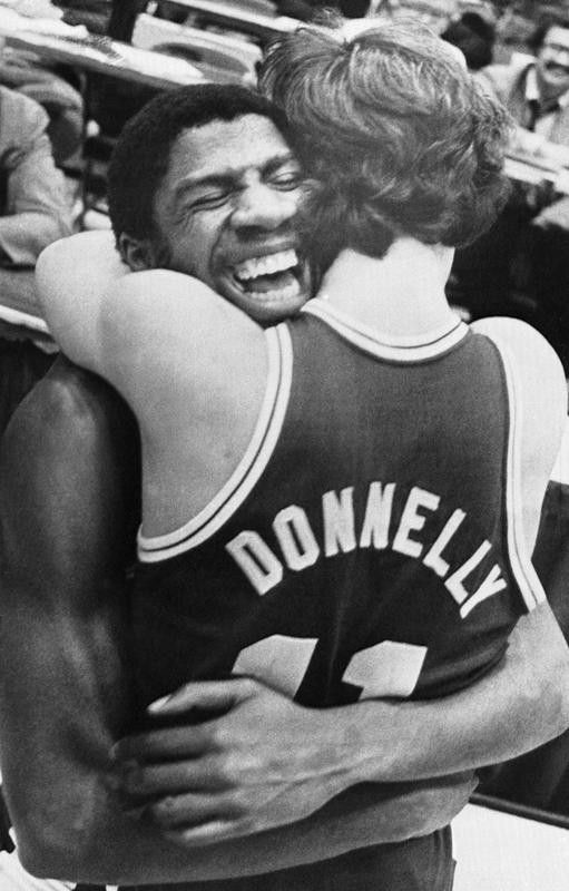 Michigan State's Earvin "Magic" Johnson hugs Terry Donnelly after the Spartans beat Notre Dame