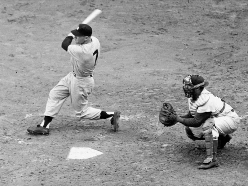 Mickey Mantle connects with relief hurler Russ Meyer's first pitch