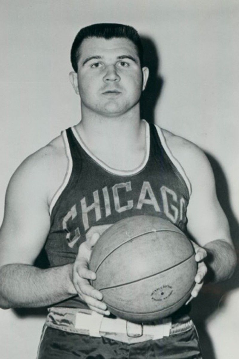 Mike Ditka  holding a basketball