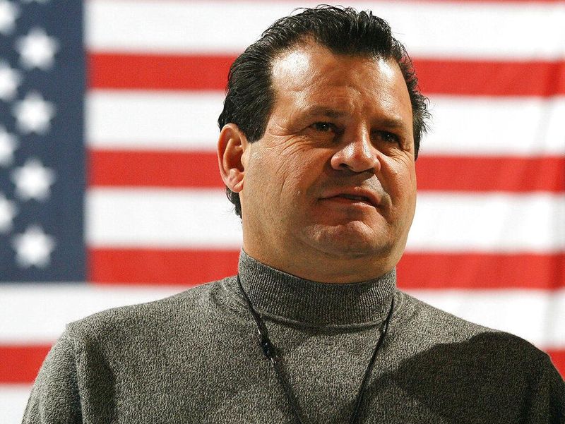 Mike Eruzione in front of United States flag