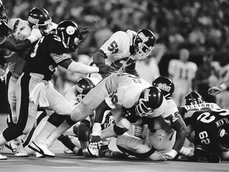 Mike Webster takes down Lawrence Taylor