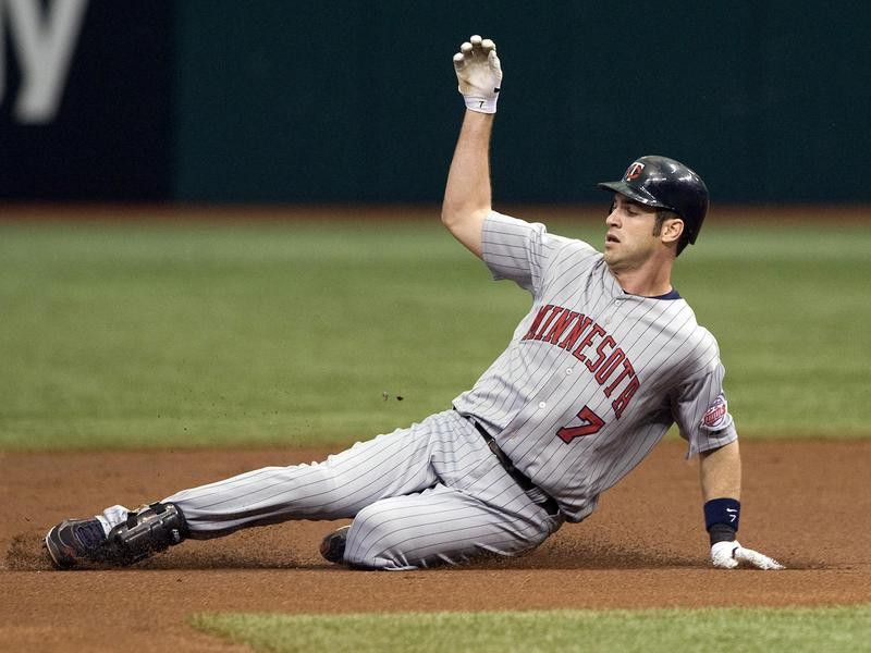Minnesota Twins catcher Joe Mauer slides into second base against the Tampa Bay Rays