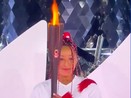 Naomi Osaka lighting torch
