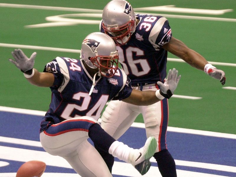 New England Patriots cornerback Ty Law celebrates