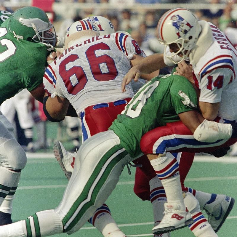 New England Patriots' quarterback Steve Grogan tackled by Philadelphia Eagles' Wes Hopkins