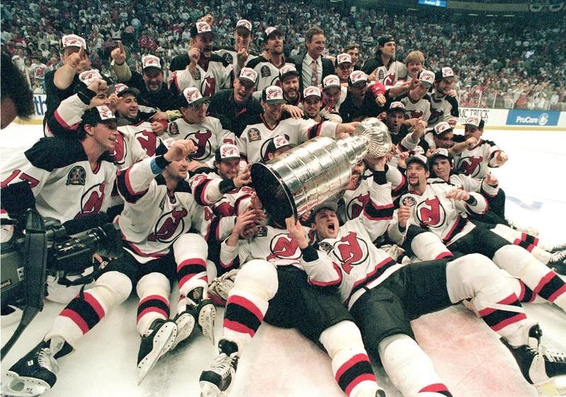 New Jersey Devils celebrate with the Stanley Cup in 1995