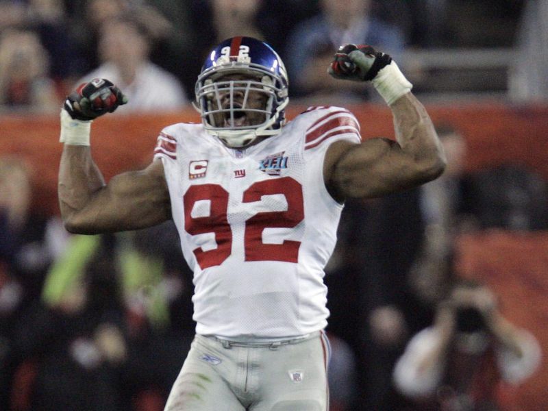 New York Giants defensive end Michael Strahan reacts