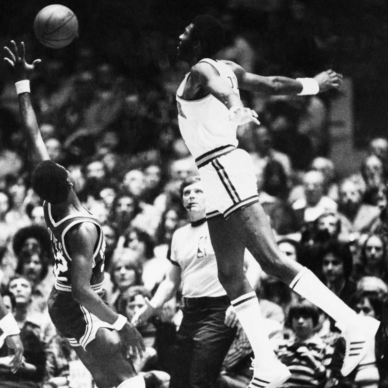 New York Knicks' Bob McAdoo appears to be flying with arms spread