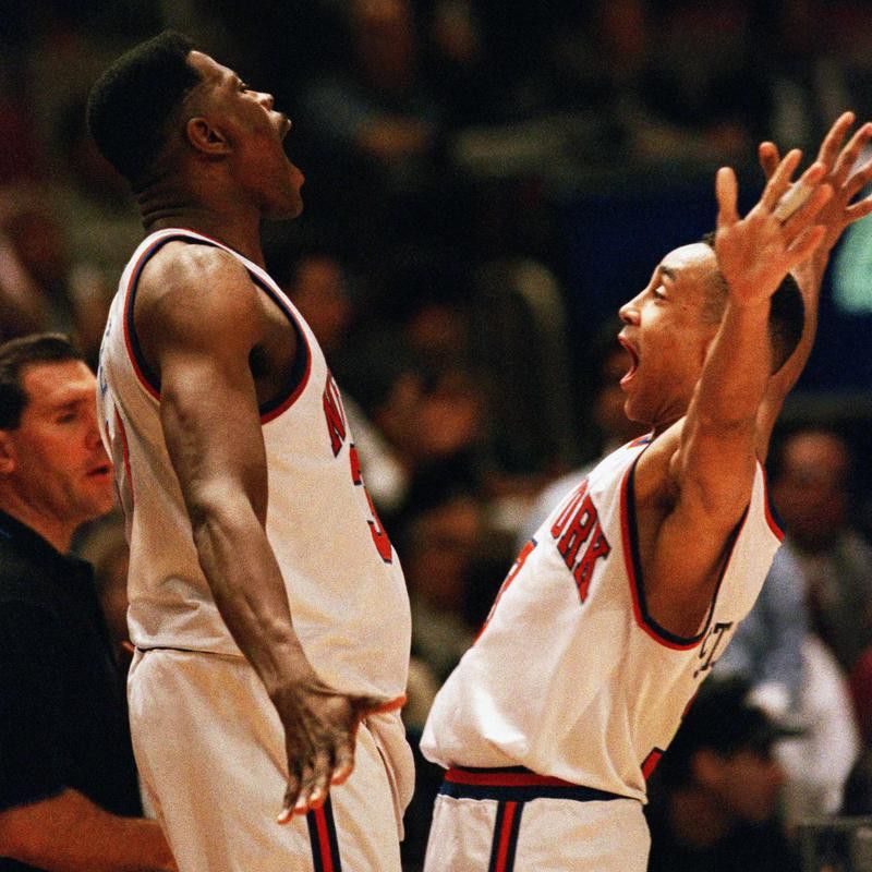New York Knicks guard John Starks celebrates with Patrick Ewing
