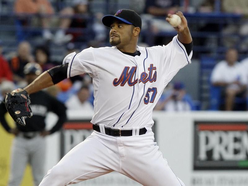 New York Mets starting pitcher Johan Santana throws