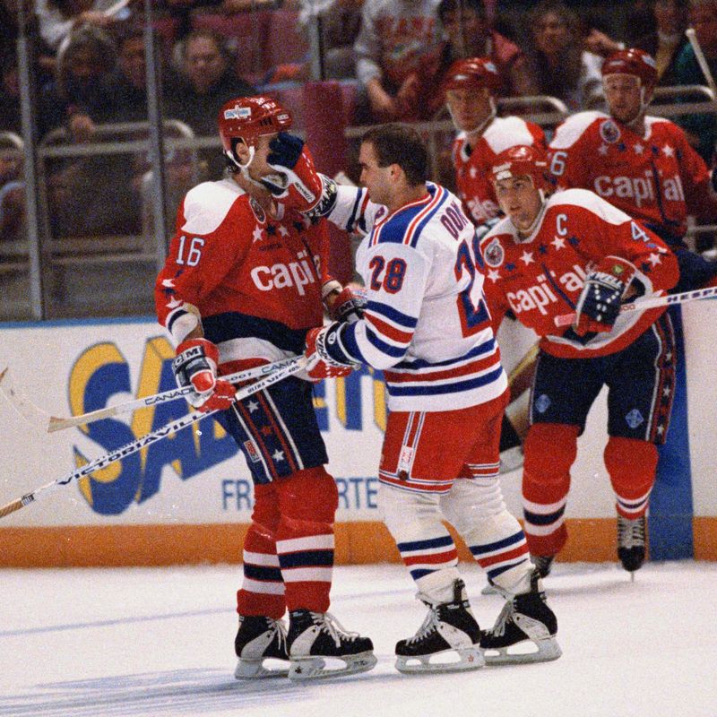 New York Rangers Tie Domi shoves glove in face of Washington Capitals Alan May