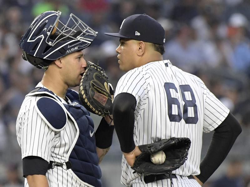 New York Yankees catcher Gary Sanchez confers with pitcher Dellin Betances