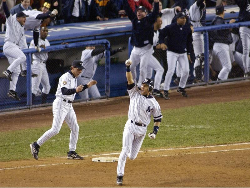 New York Yankees' Derek Jeter celebrates his game-winning home run