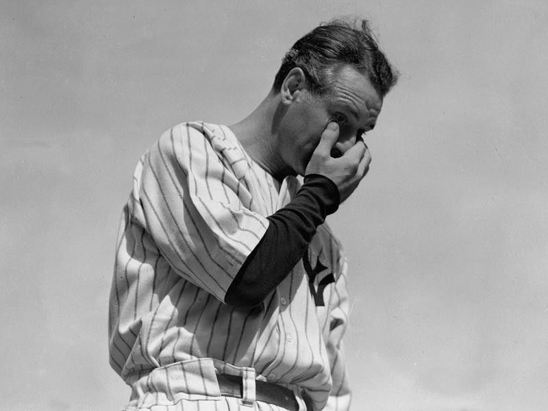 New York Yankees' Lou Gehrig wipes away tear while speaking at tribute