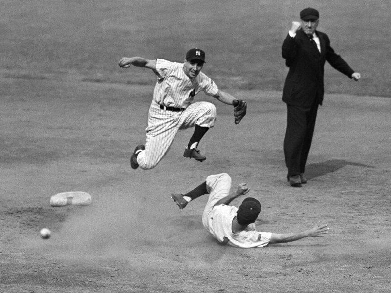 New York Yankees shortstop Phil Rizzuto completes a double play