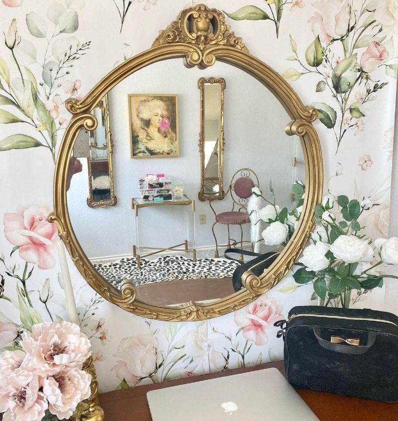Ornate mirror on cloffice wall