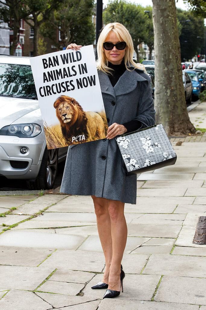 Pamela Anderson with PETA sign