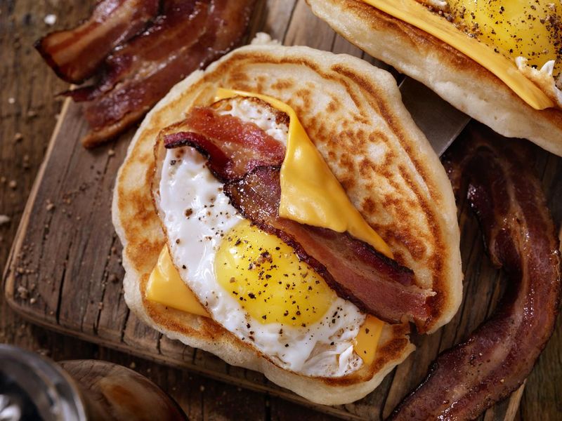 Pancake Breakfast Taco with Suny side up Eggs, Bacon, Cheese,  hangover cure idea