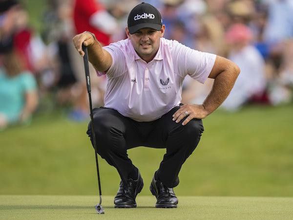 Patrick Reed lines up putt