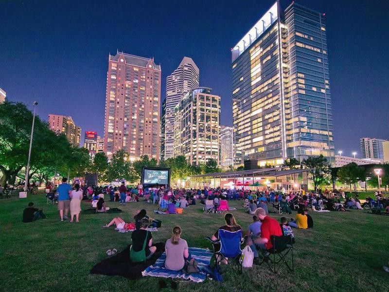 People sitting and watching a movie in Discovery Green