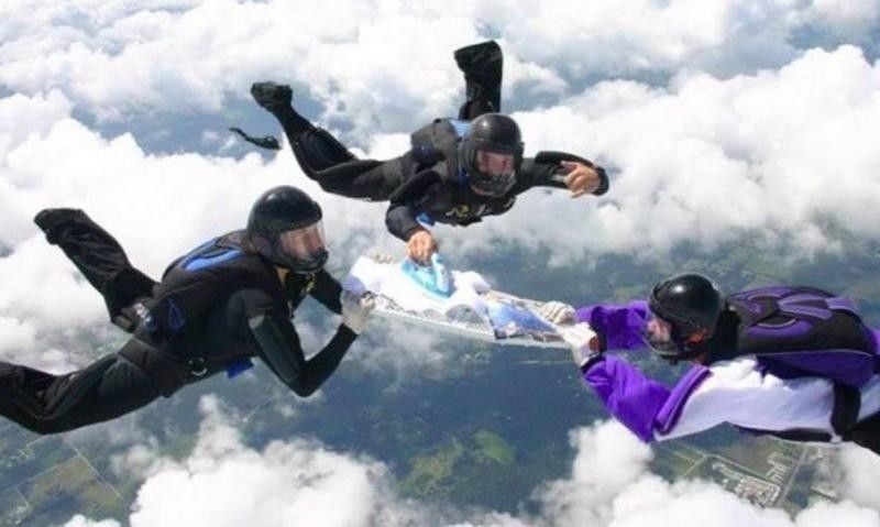 People sky diving while ironing