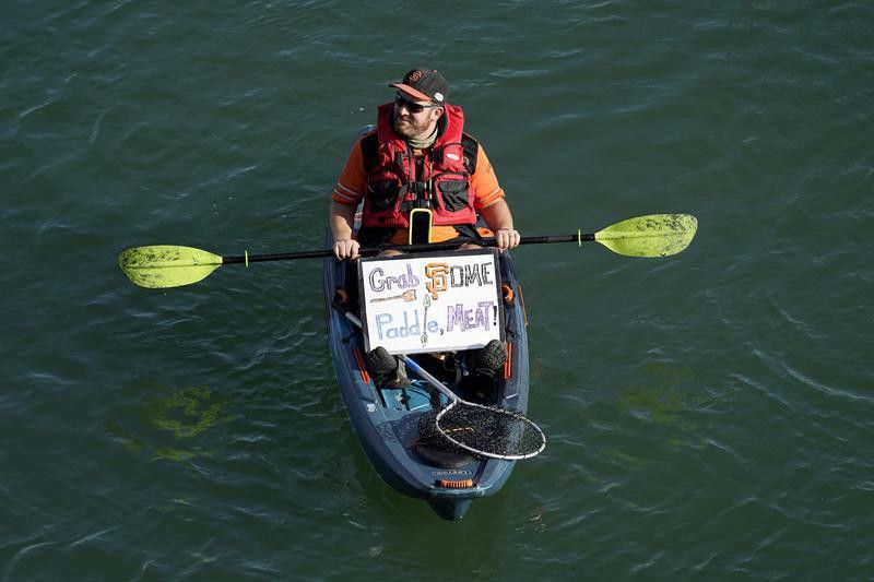 Person kayaks in McCovey Cove outside of Oracle Park