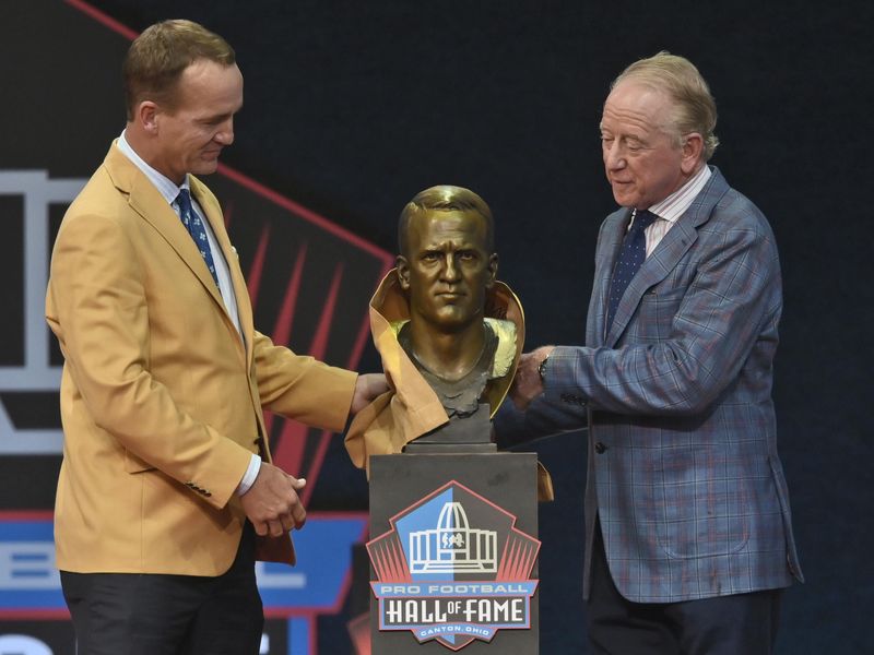 Peyton Manning with his bust