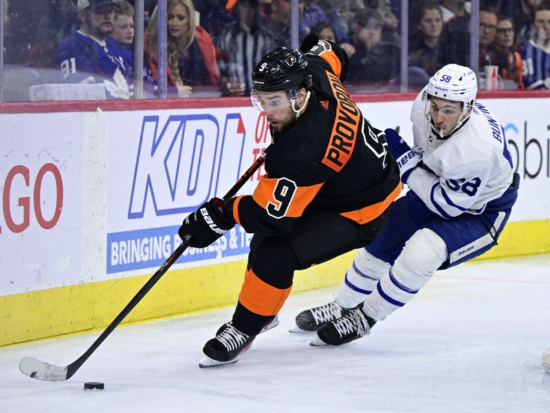 Philadelphia Flyers' Ivan Provorov skates the puck past Toronto Maple Leafs' Michael Bunting