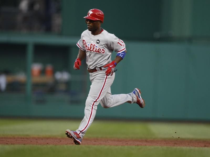 Philadelphia Phillies' Jimmy Rollins rounds bases after hitting home run