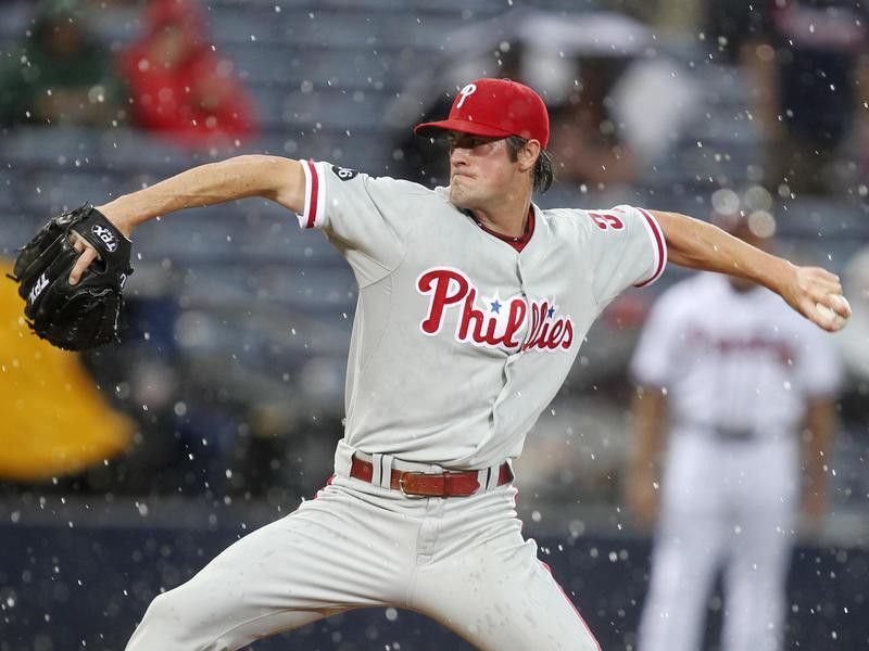 Philadelphia Phillies starter Cole Hamels works in rain