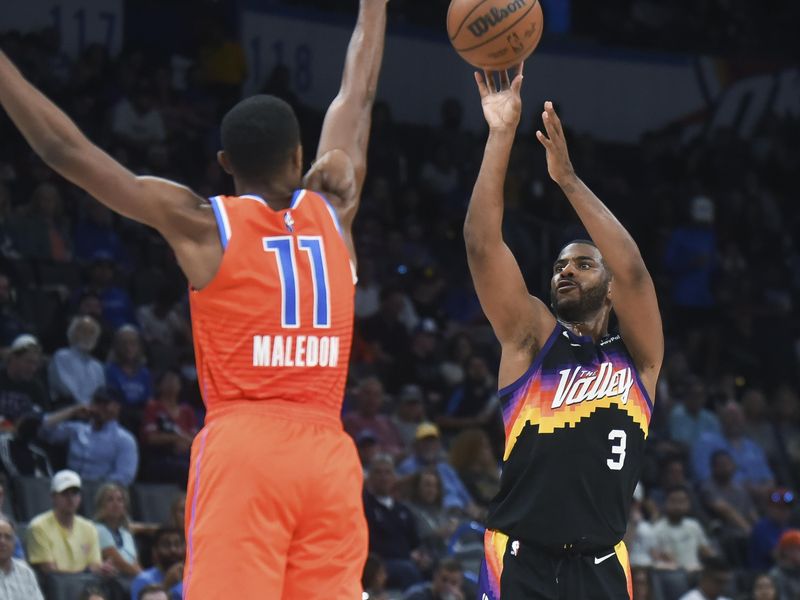 Phoenix Suns guard Chris Paul shoots over Oklahoma City Thunder guard Theo Maledon