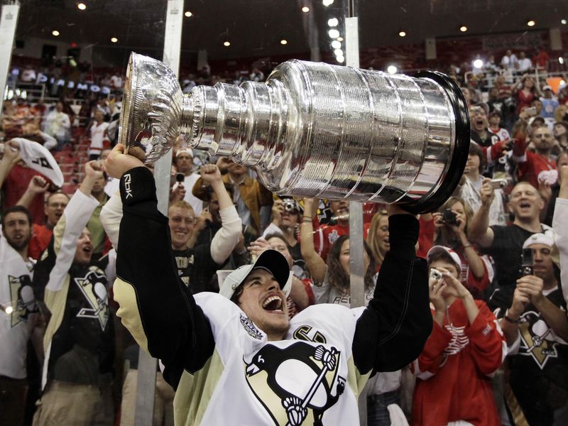 Pittsburgh Penguins' captain Sidney Crosby raises Stanley Cup
