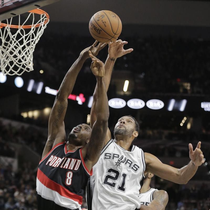 Portland Trail Blazers' Al-Farouq Aminu blocked by San Antonio Spurs' Tim Duncan