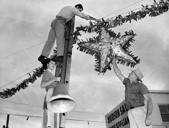 Putting up holiday decorations
