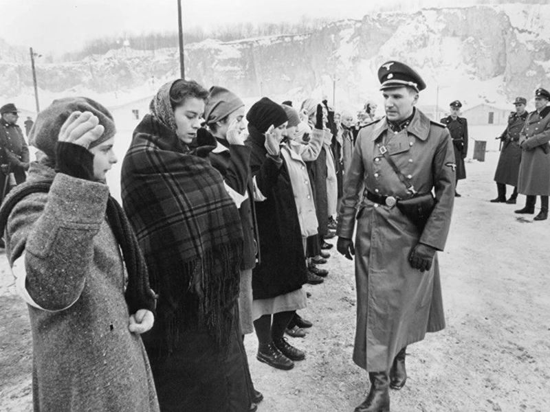 Ralph Fiennes surveying the group in Schindler's List