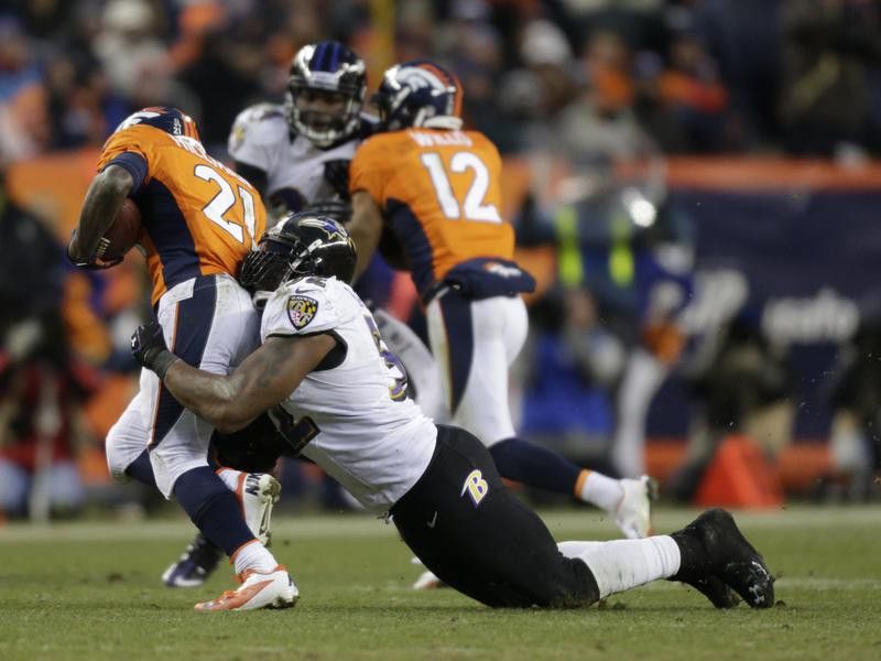 Ray Lewis of the Baltimore Ravens tackles Ronnie Hillman of the Denver Broncos