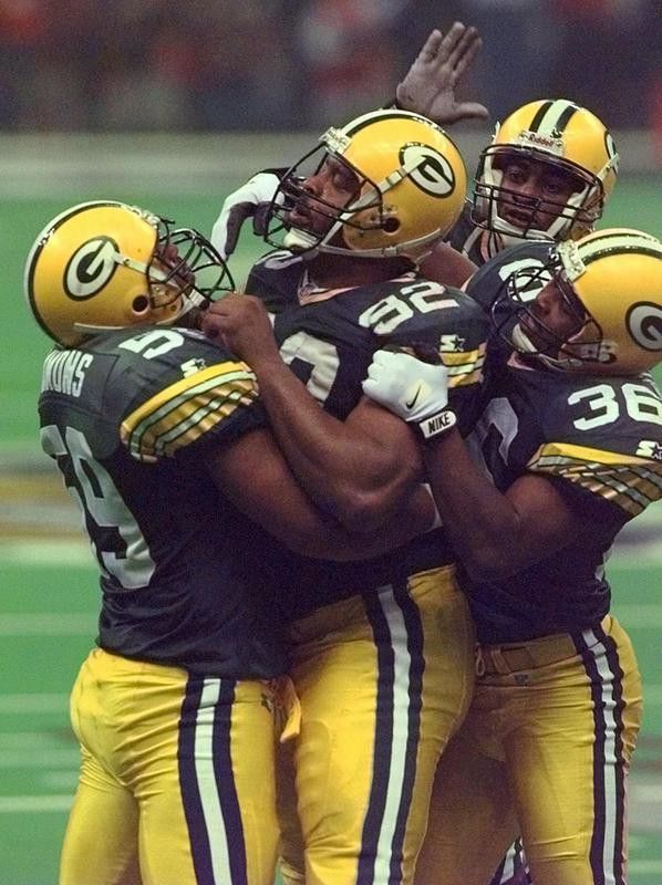 Reggie White congratulated by Packers teammates