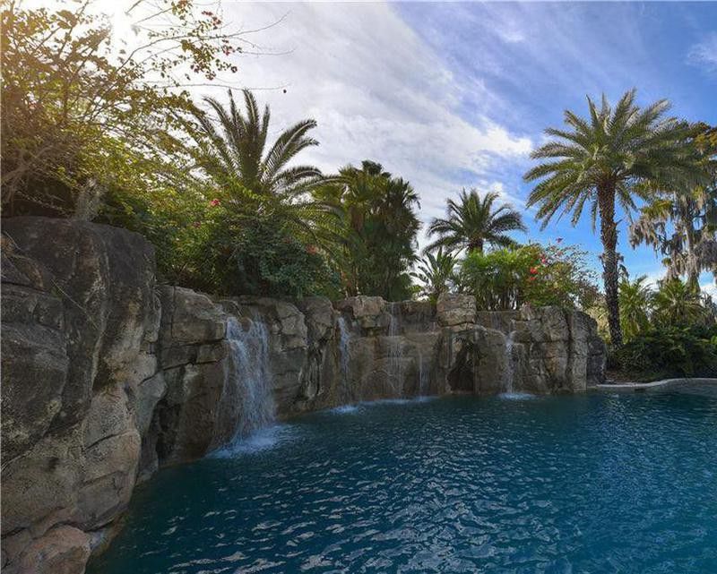 Resort-style water features by Shaq's pool