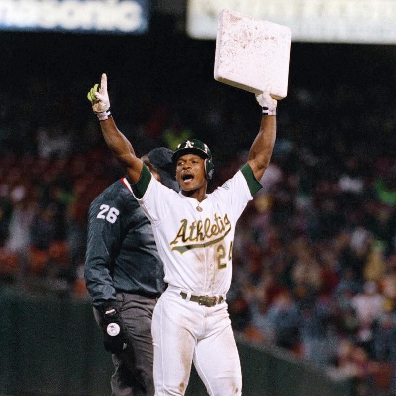 Rickey Henderson reacts with a base