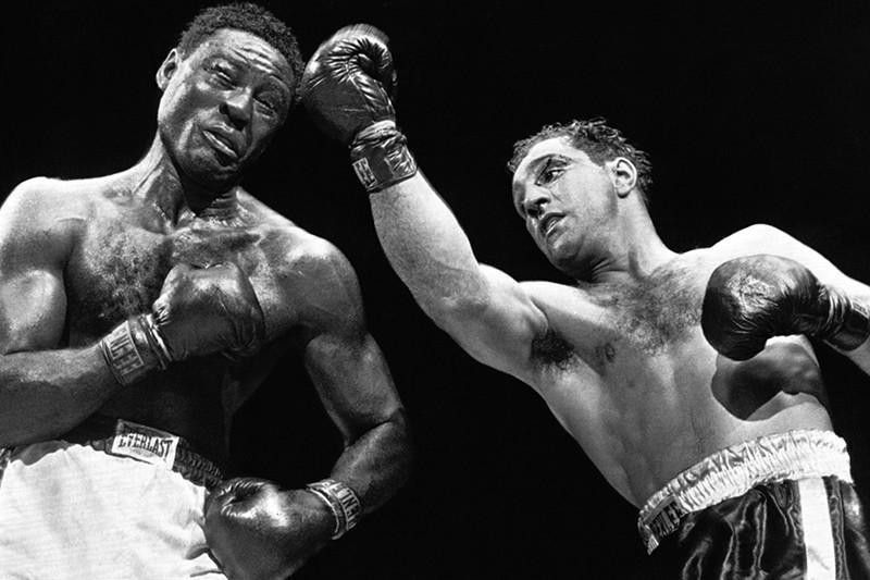 Rocky Marciano beats Ezzard Charles in 1954