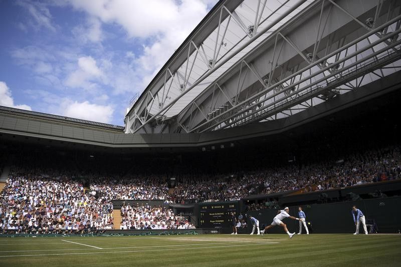 Roger Federer returns to Novak Djokovic at Wimbledon in 2019
