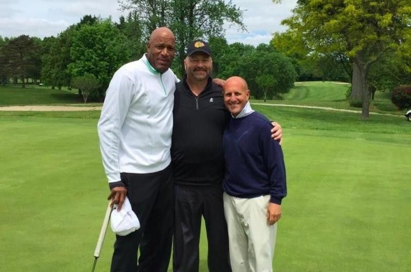 Ron Harper poses while playing golf