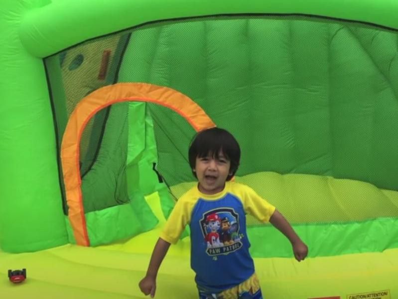 Ryan playing with inflatable slide
