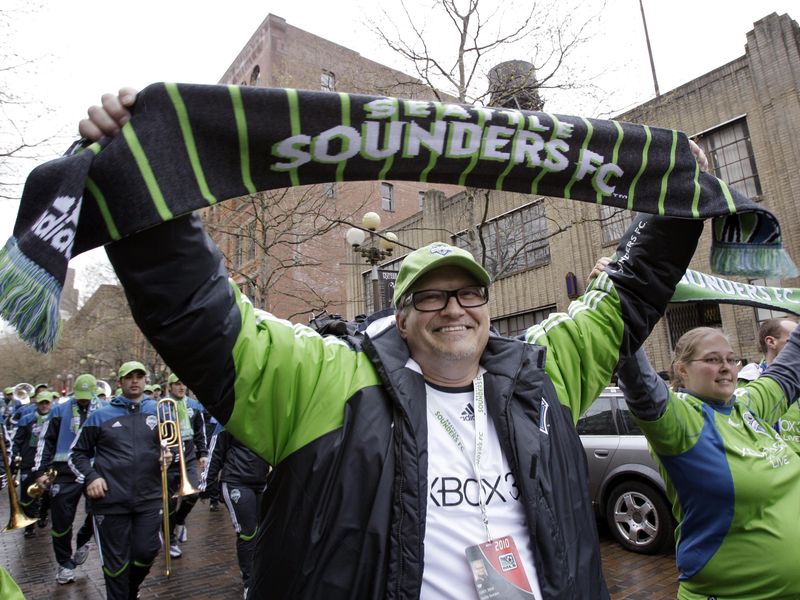 Seattle Sounders part-owner Drew Carey leads fans