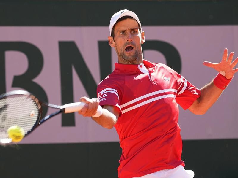 Serbia's Novak Djokovic slams a forehand