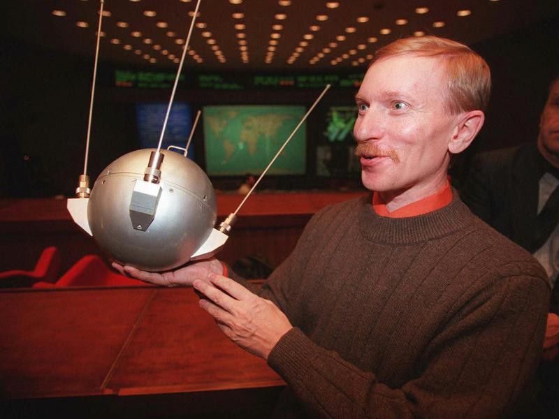 Sergei Samburov with a model of space satellite