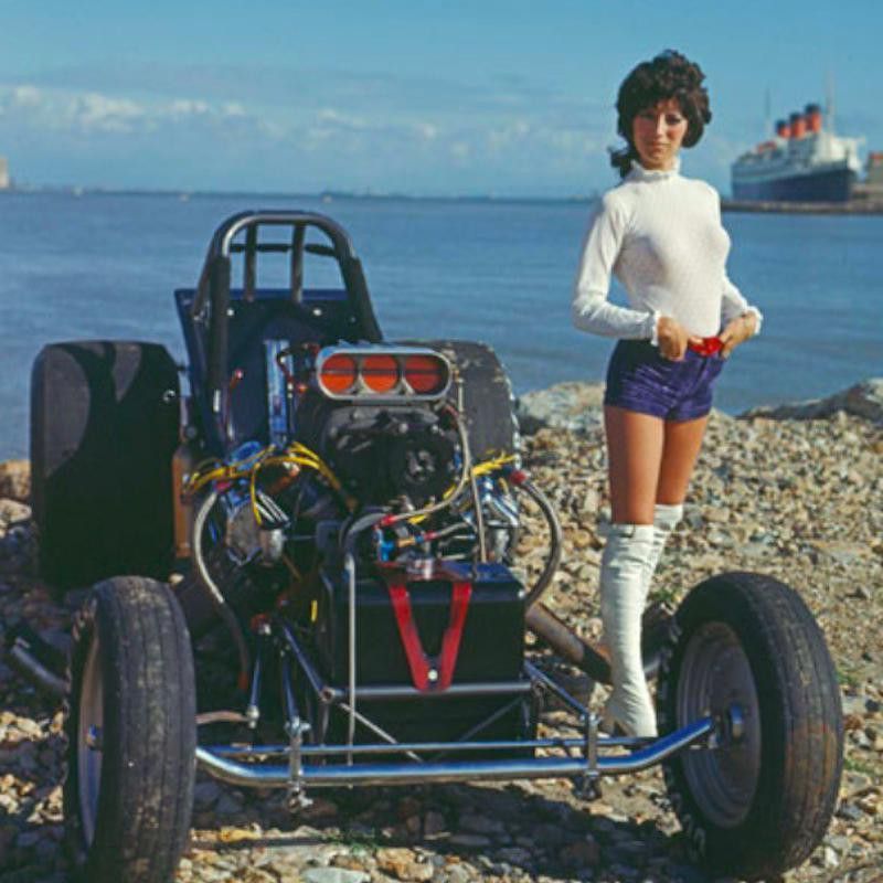 Shirley “Cha Cha” Muldowney poses on vehicle